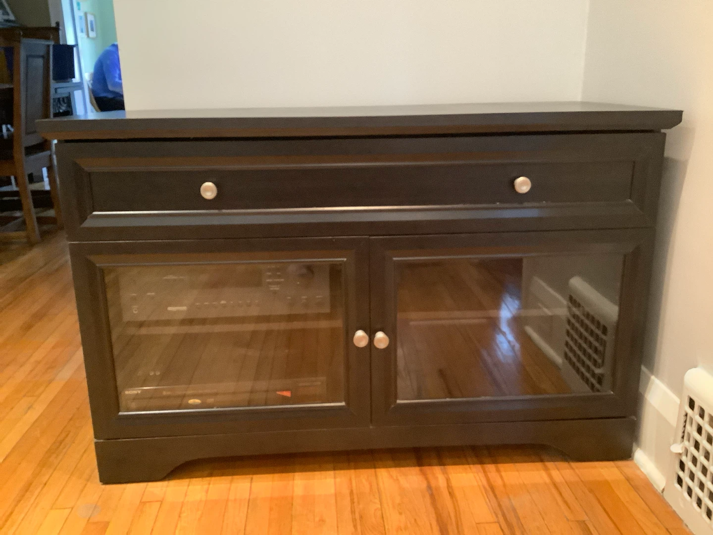 Black media cabinet with glass doors