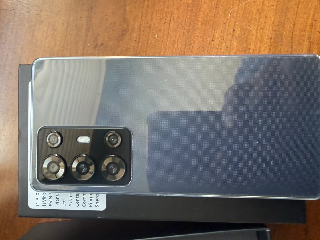 Black Smartphone with Quad Camera and Accessories