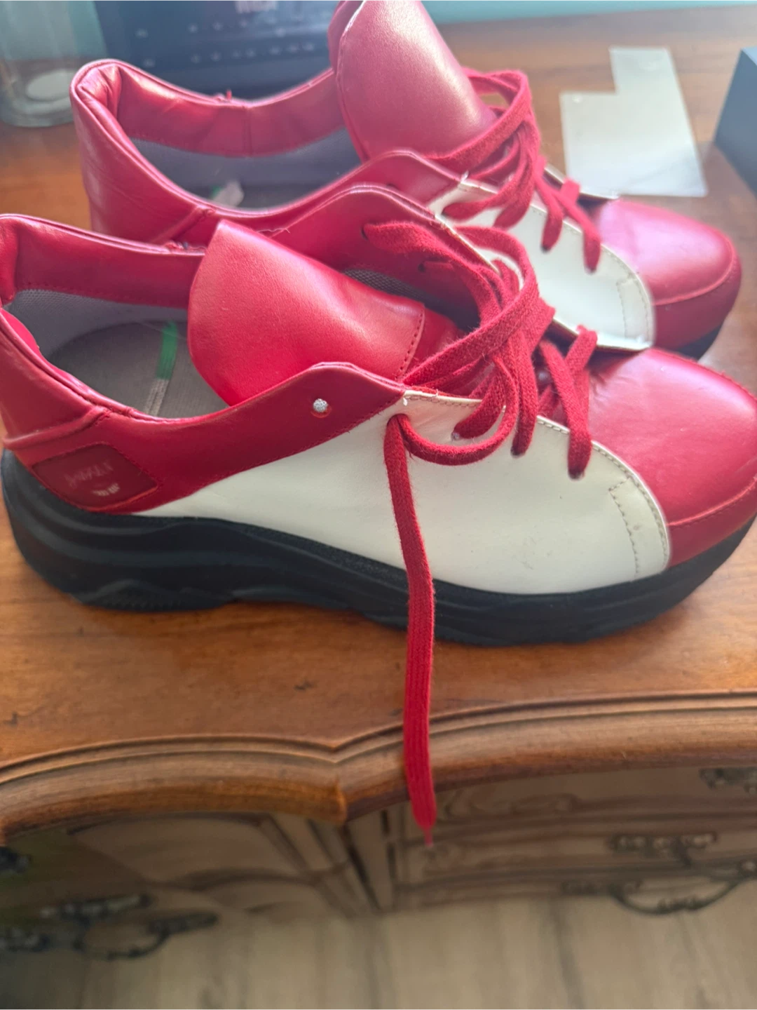 Red and white platform sneakers