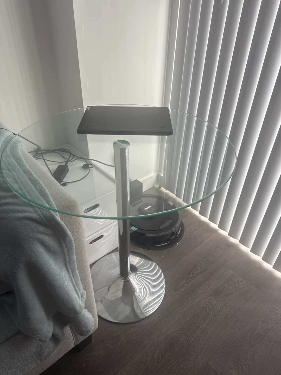 Round glass top side table with chrome base