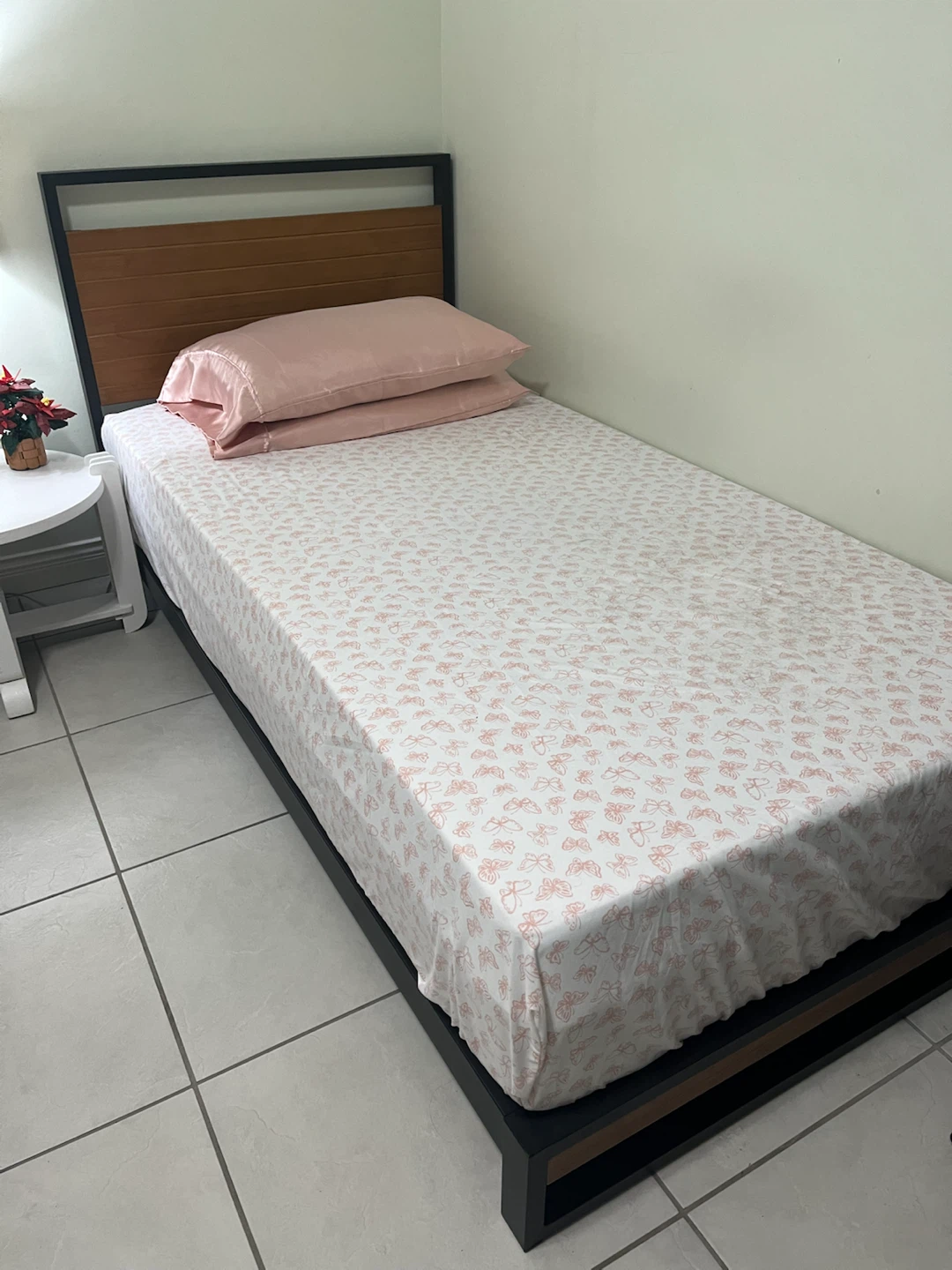 Twin size bed frame with wooden headboard
