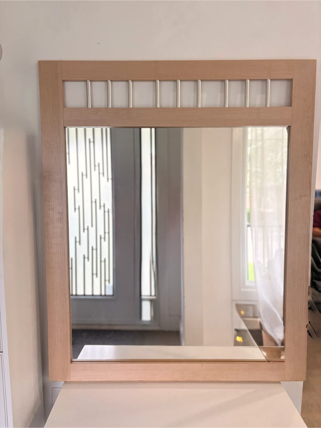Large wood framed mirror with silver accents