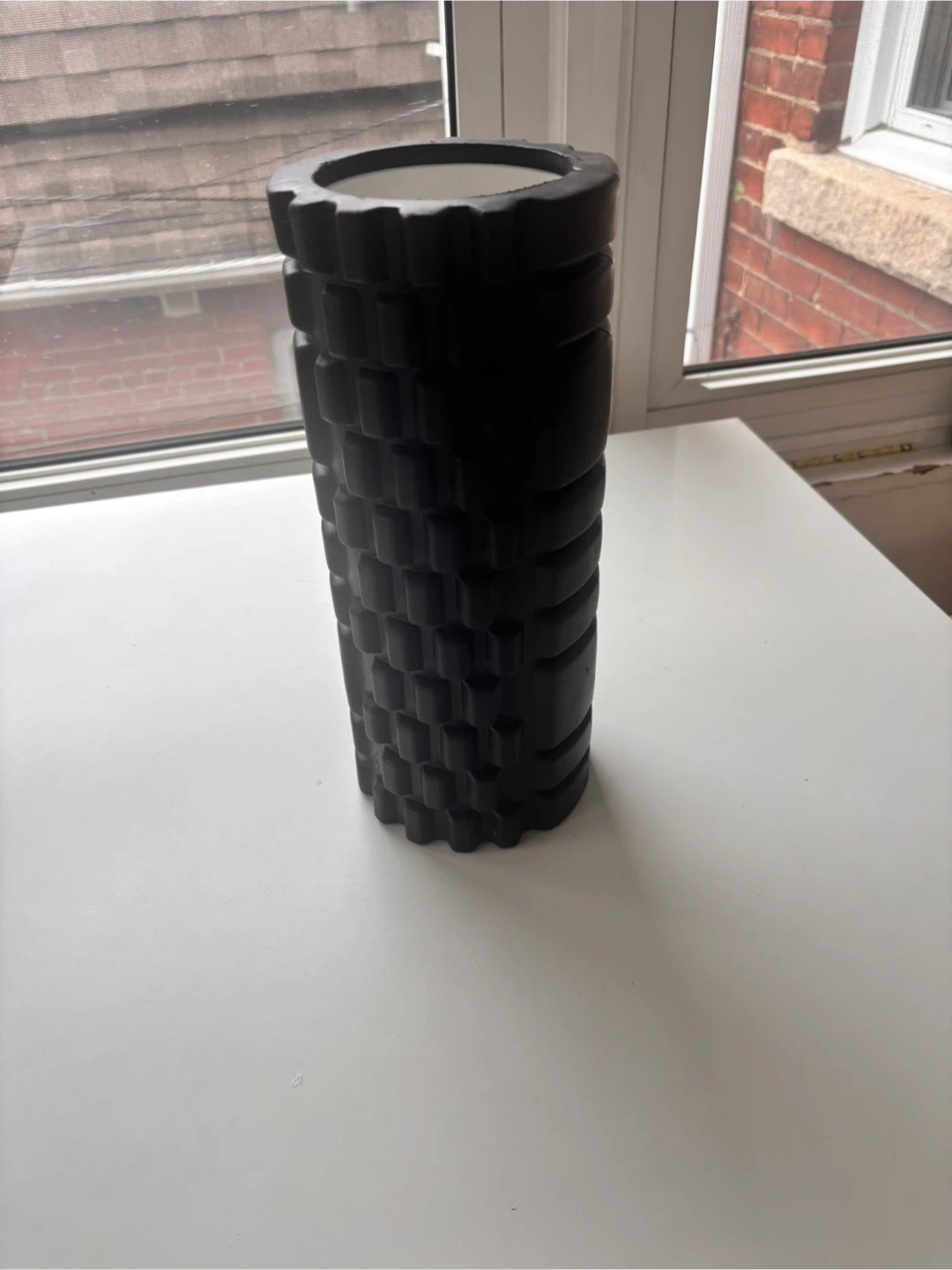 Black foam roller for muscle recovery