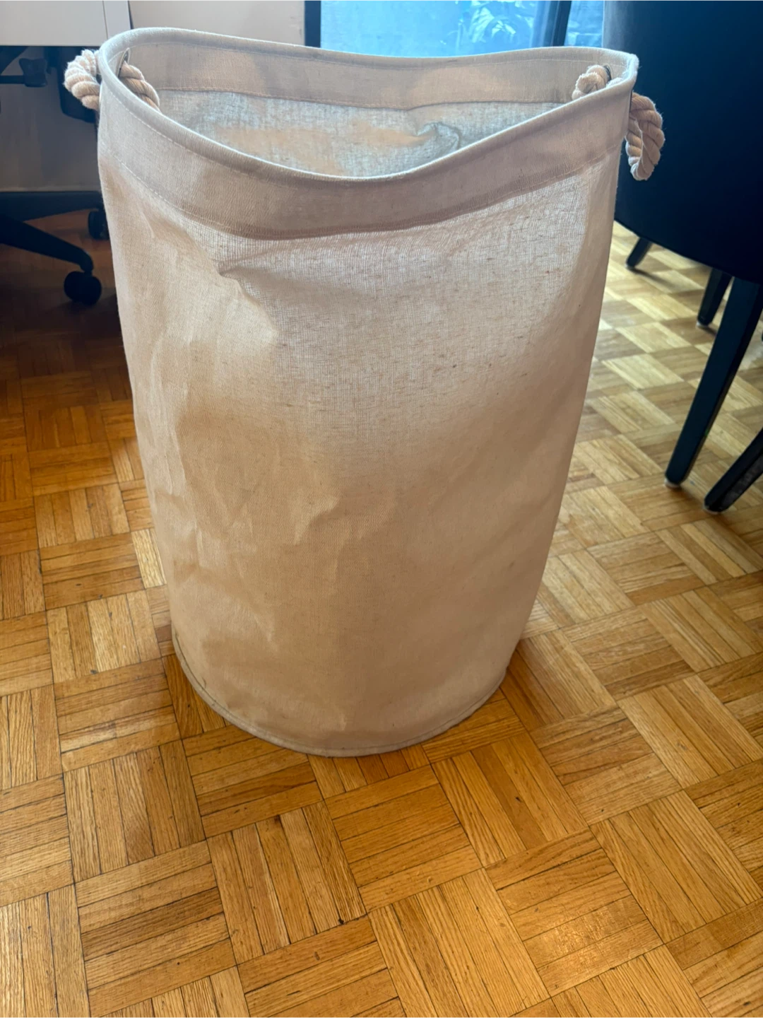Cream fabric laundry hamper with rope handles