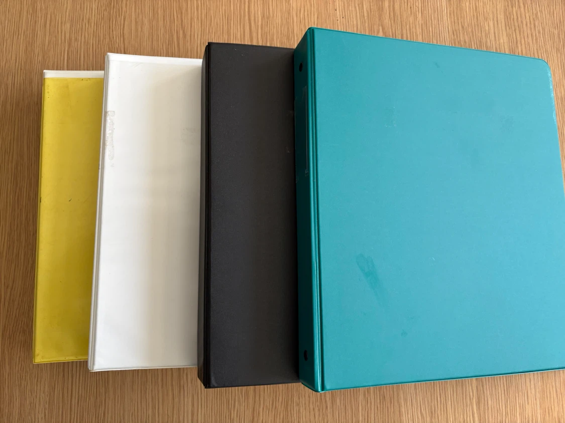Four 1” 3-ring binders