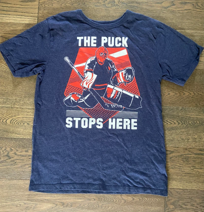 EUC Blue Hockey Goalie “Puck Stops Here” Graphic Tee 10-12 yrs