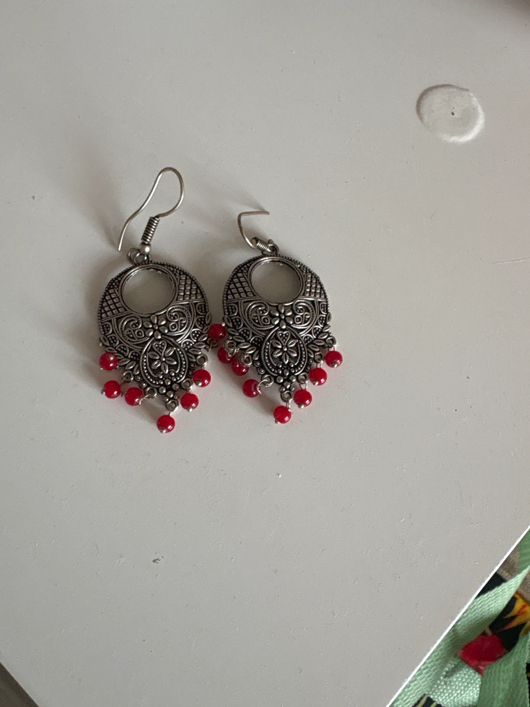 Silver-toned drop earrings with red beads