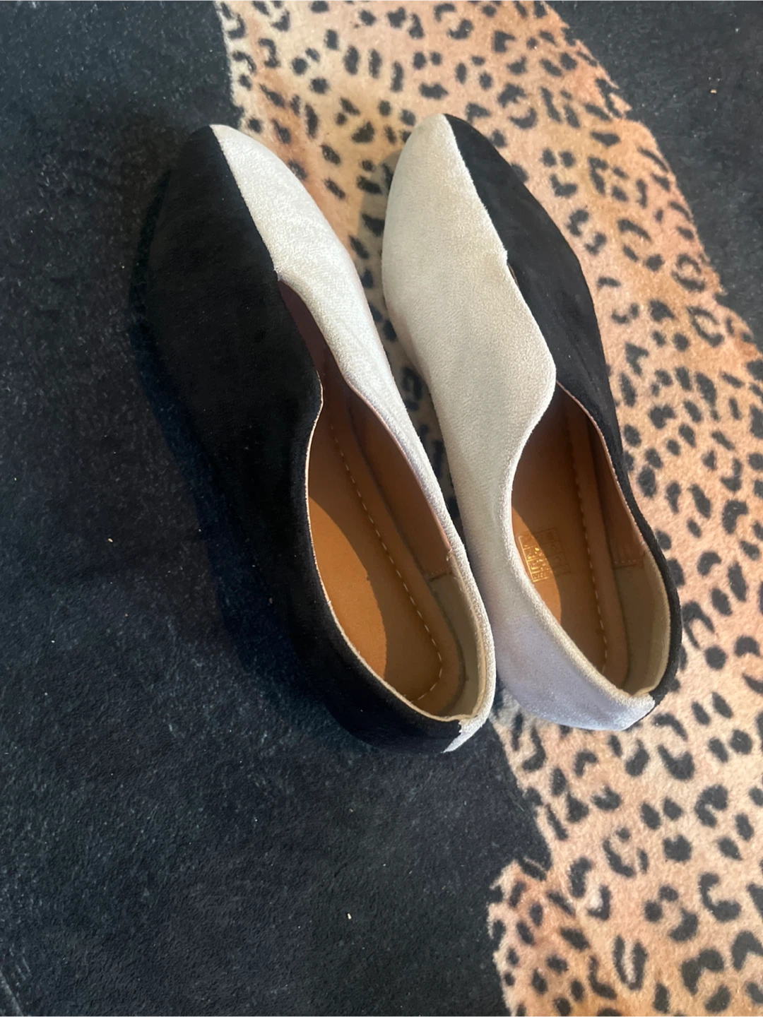 Two-tone black and white pointed toe flats