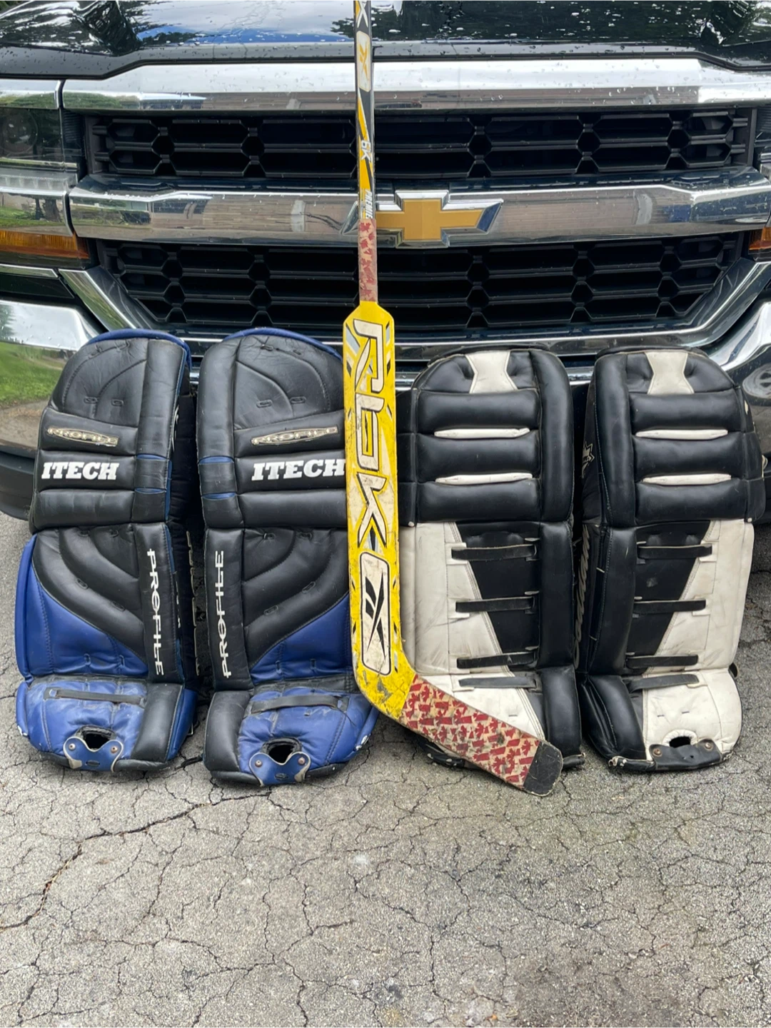 2 pairs of goalie pads and stick