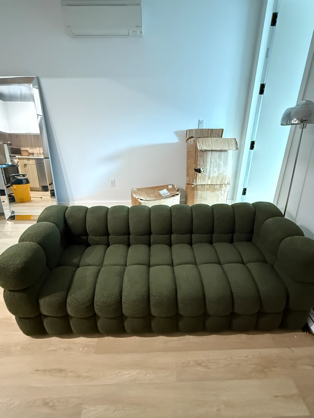 Dark green upholstered sofa