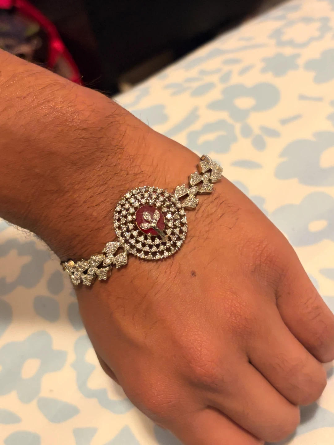 Bracelet with red stone and flower