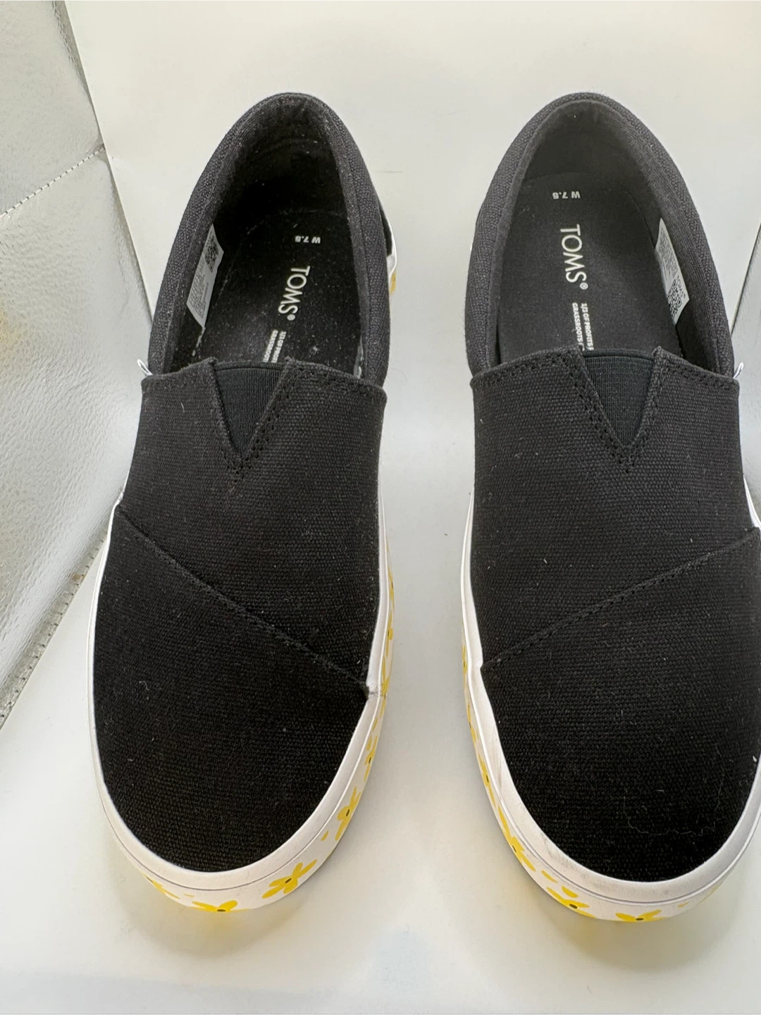 7.5 - TOMS Black Slip-On Shoes with Yellow Flowers - Size 7.5