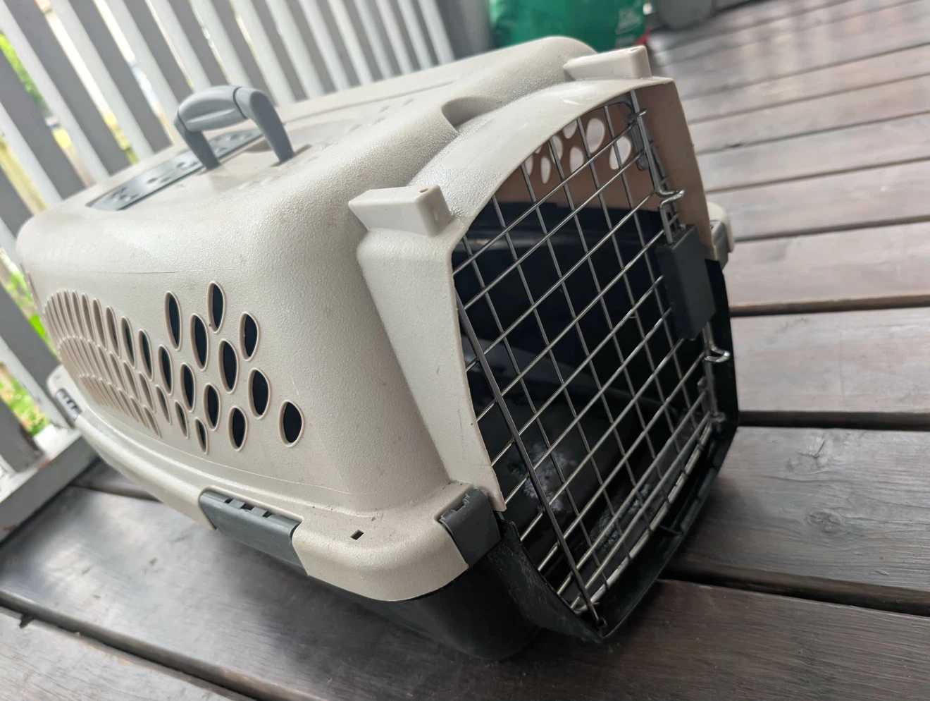Hard shell pet carrier in tan and black
