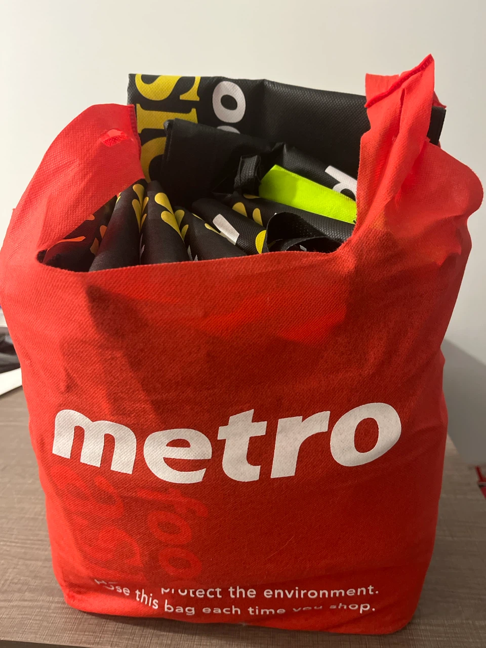 Approximately 50 folded reusable bags