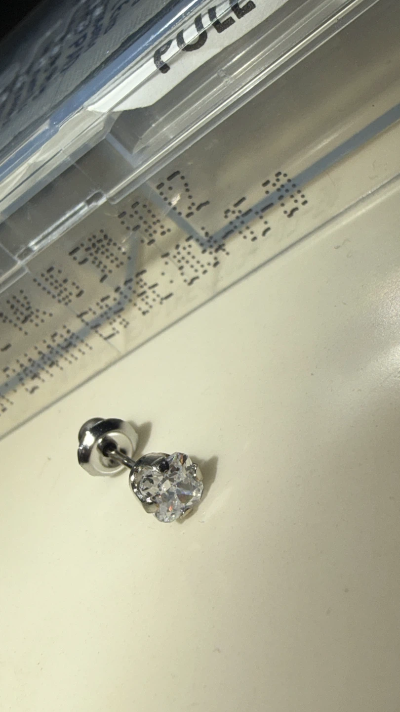 Single 14K white gold earring with a crystal stone