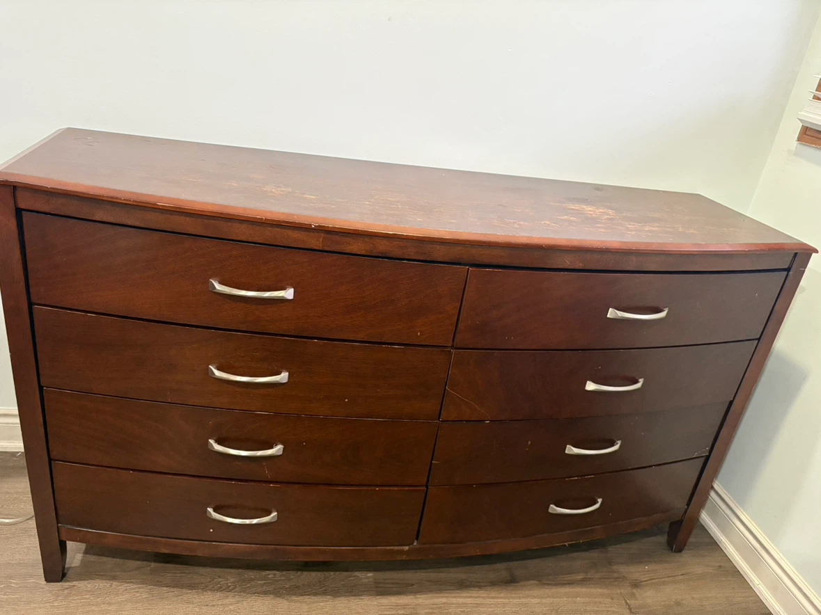 Dark brown curved front 8 drawer dresser
