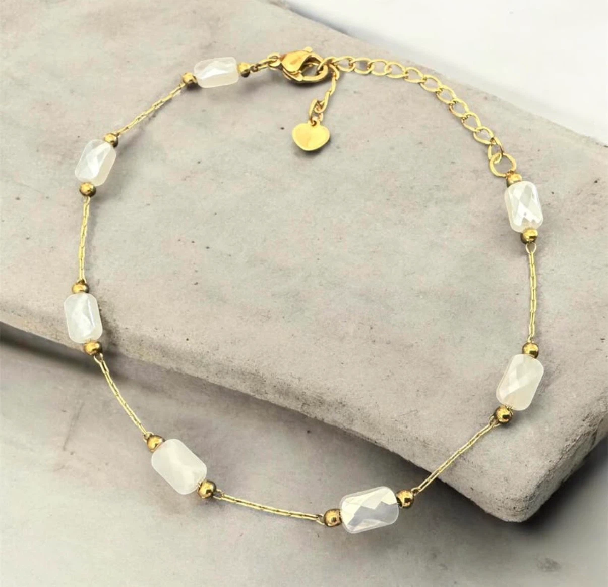 Gold-tone bracelet with white beads