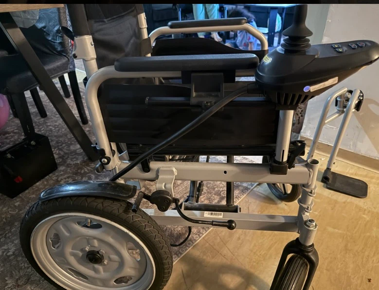 Black and silver folding electric wheelchair
