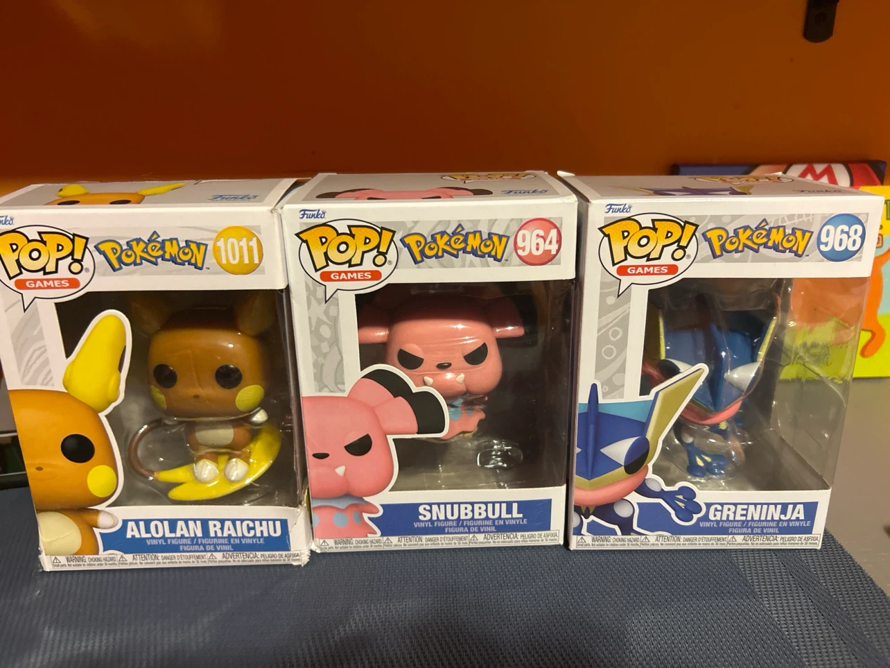 Funko Pop! Pokémon Alolan Raichu, Snubbull, and Greninja Figures