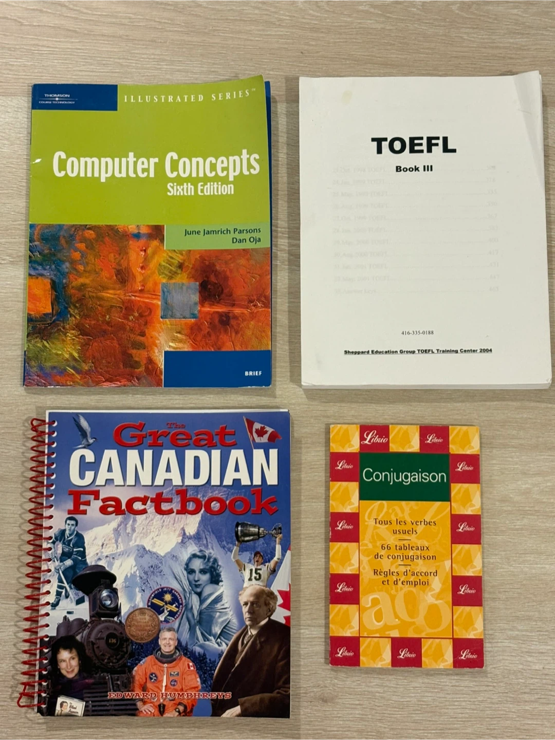 Assorted educational books and French verb guide - photo 2