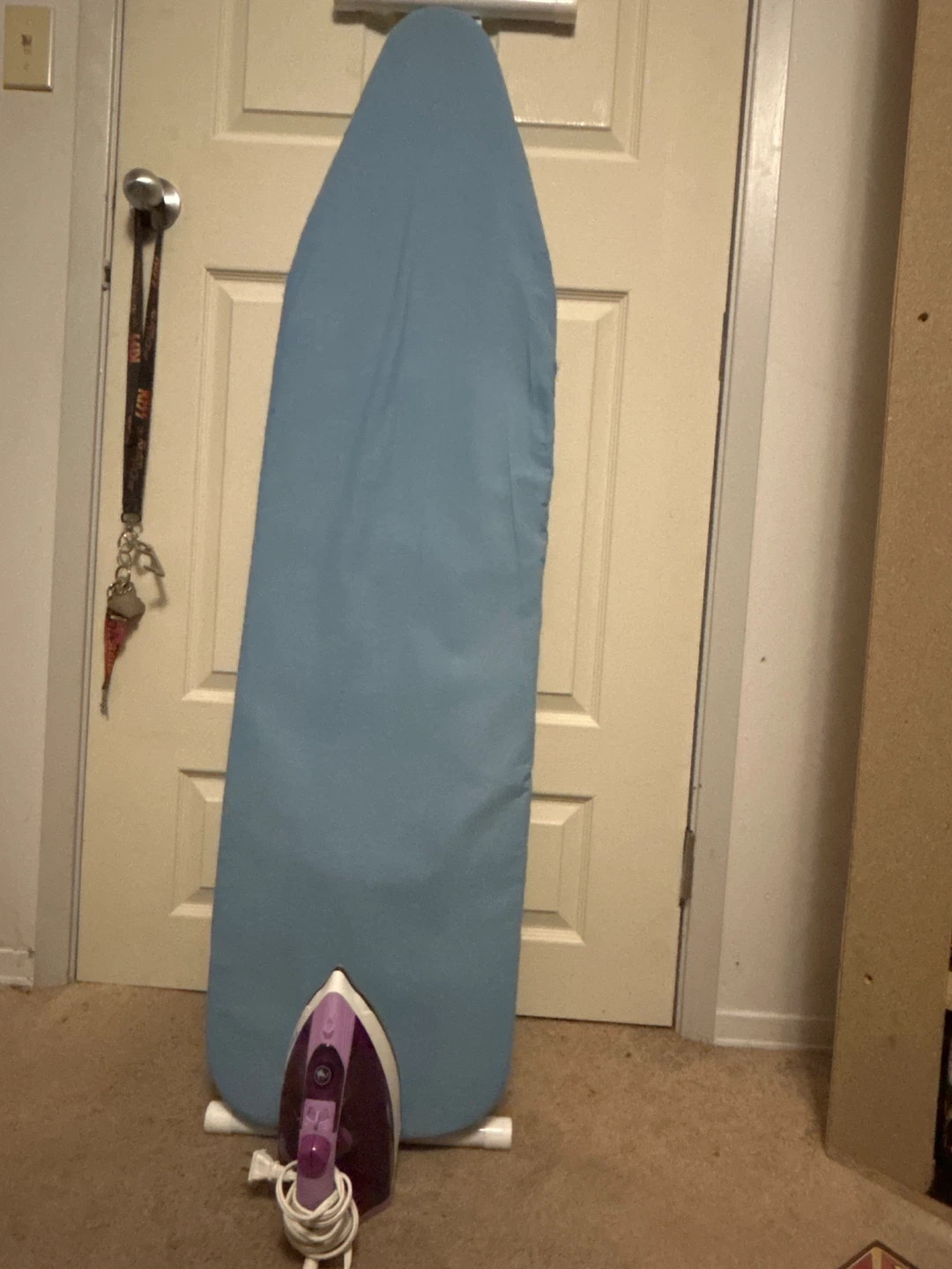 Light Blue Ironing Board with Iron