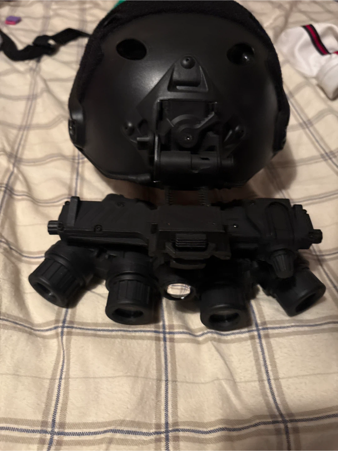 Black tactical helmet with quad night vision goggles