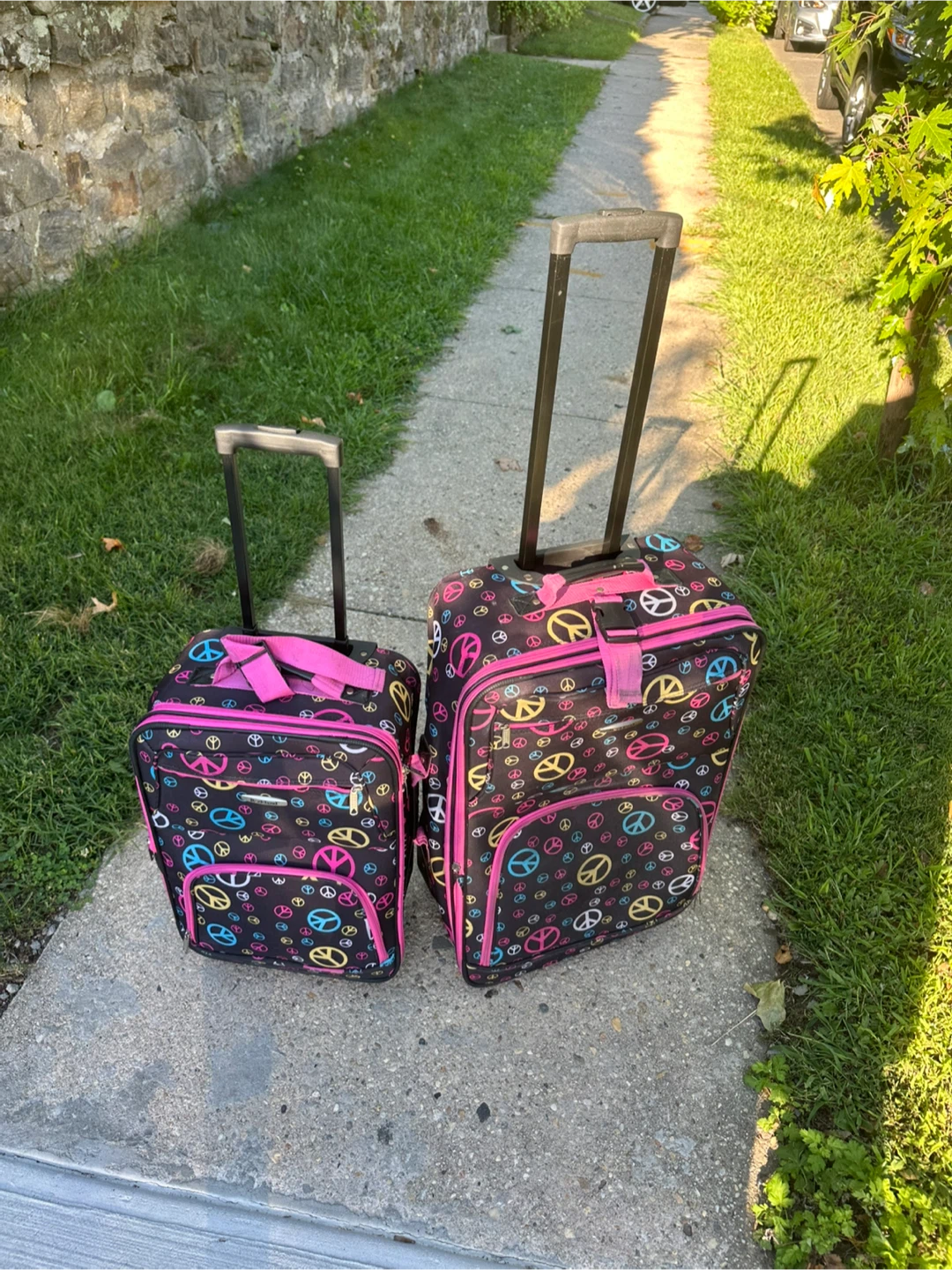 Set of 2 Peace Sign Rolling Suitcases
