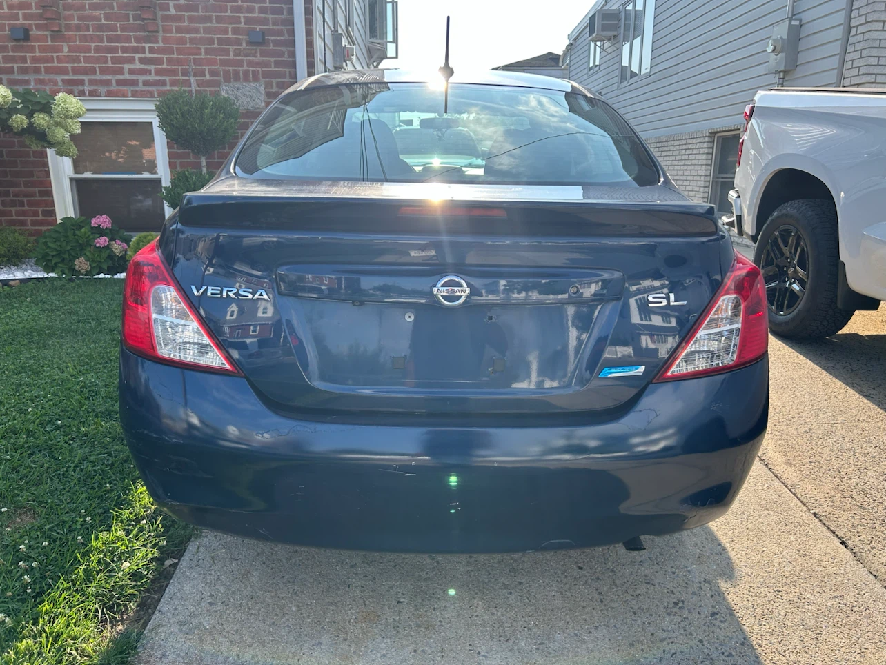 Blue Nissan Versa SL Sedan - photo 2