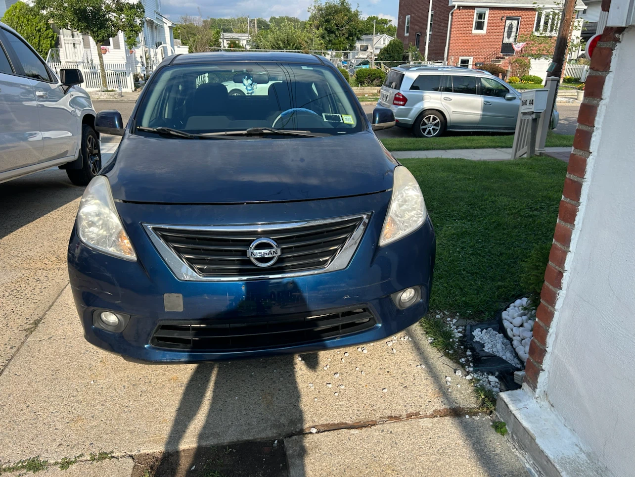 Blue Nissan Versa SL Sedan - photo 3