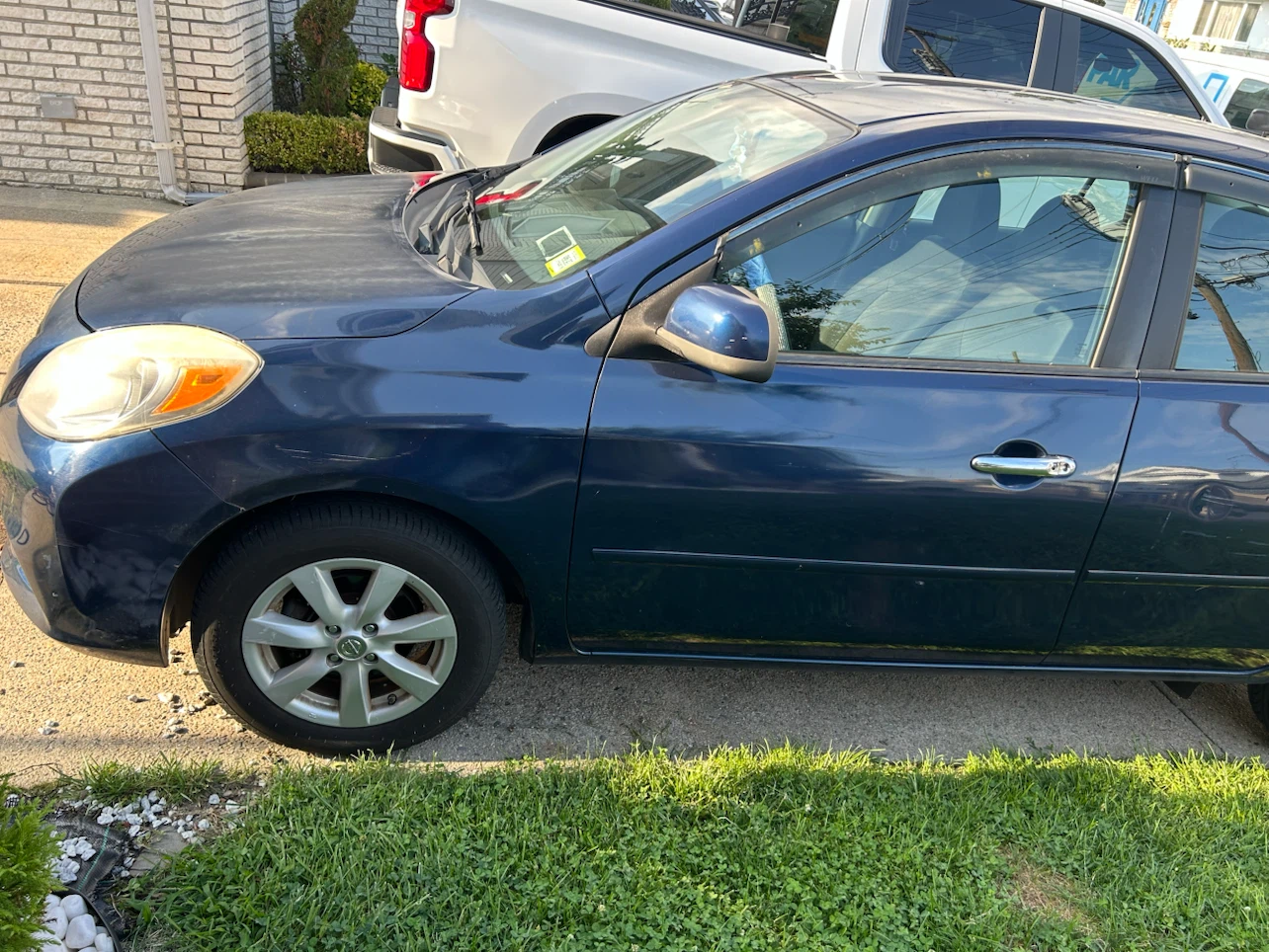 Blue Nissan Versa SL Sedan - photo 4
