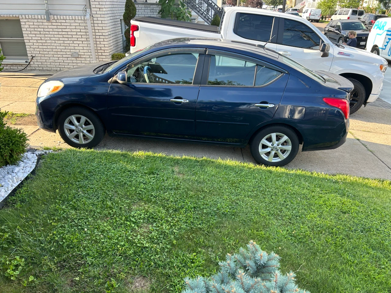 Blue Nissan Versa SL Sedan - photo 5