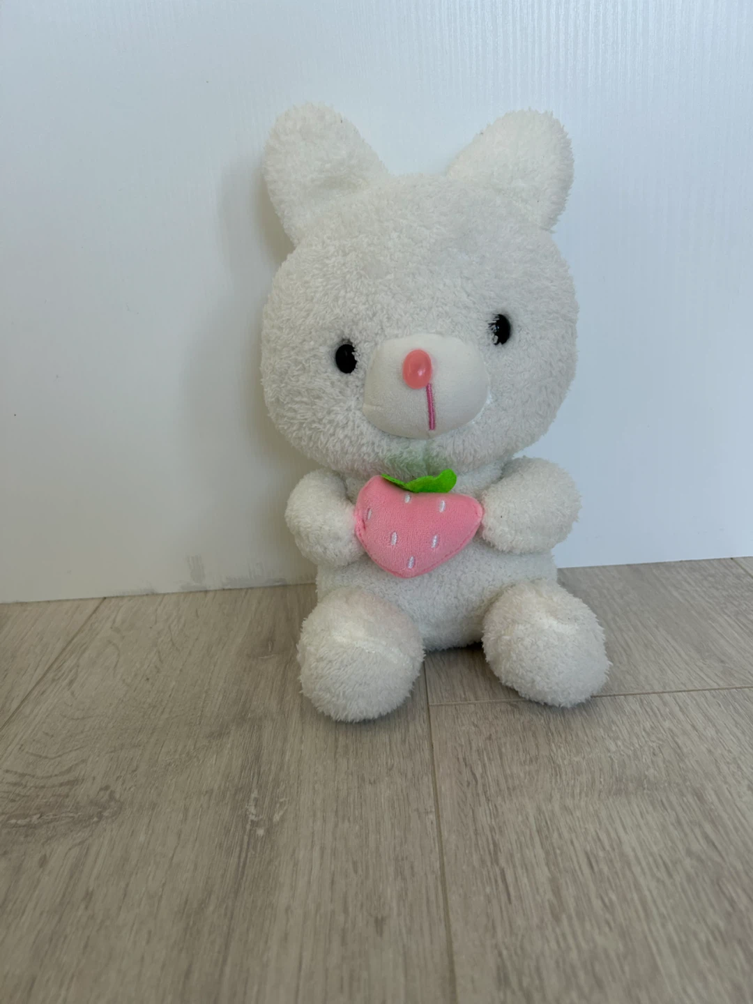 White plush bunny with strawberry