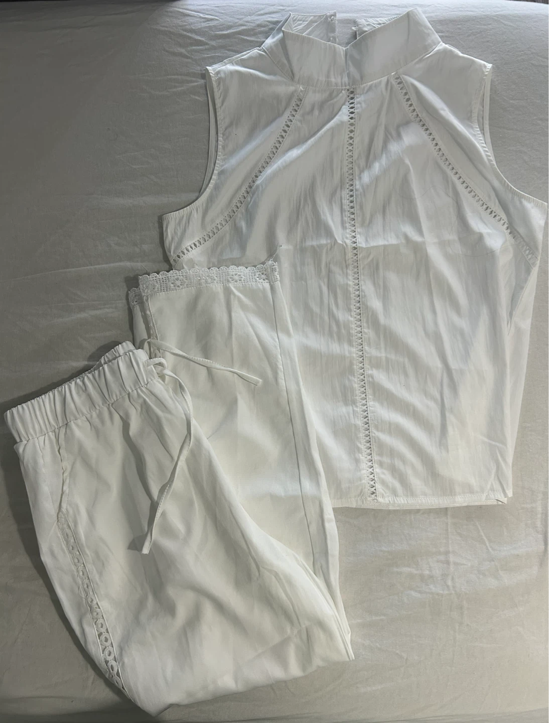 White sleeveless top and pants set