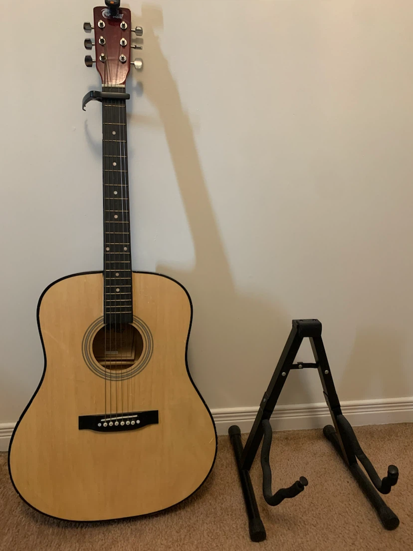 Guitar and a Black A-Frame Guitar Stand