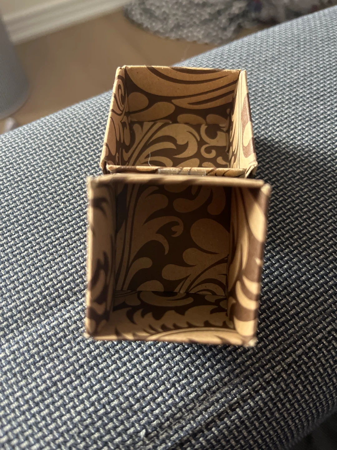 Cardboard gift box with scroll pattern