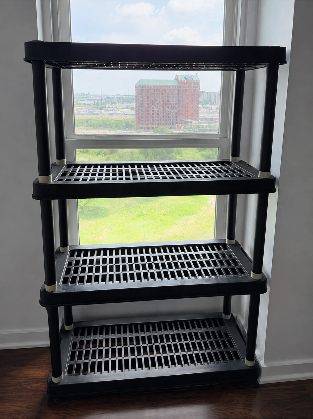 Black 4-Tier Plastic Shelving Unit (600 LB Capacity)