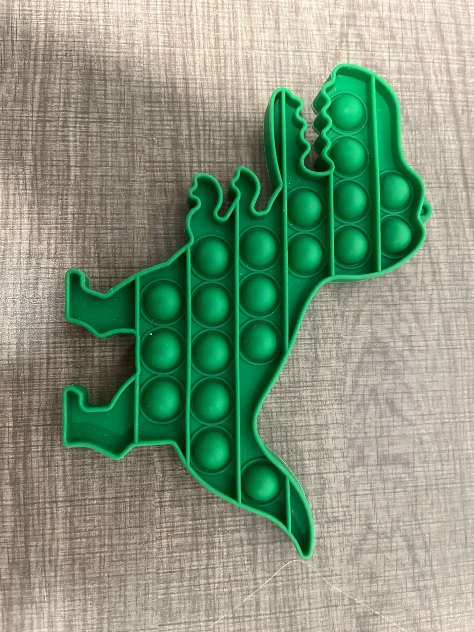 Dinosaur pop toy