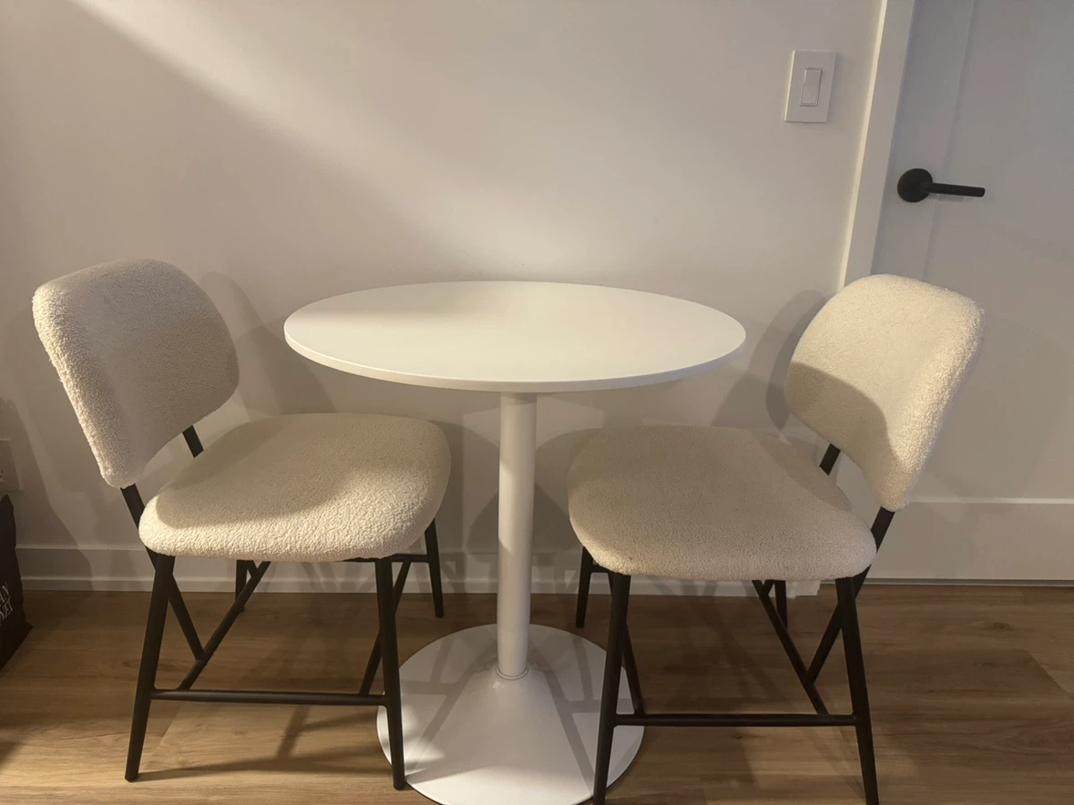 White Round Dining Table with 2 Boucle Chairs