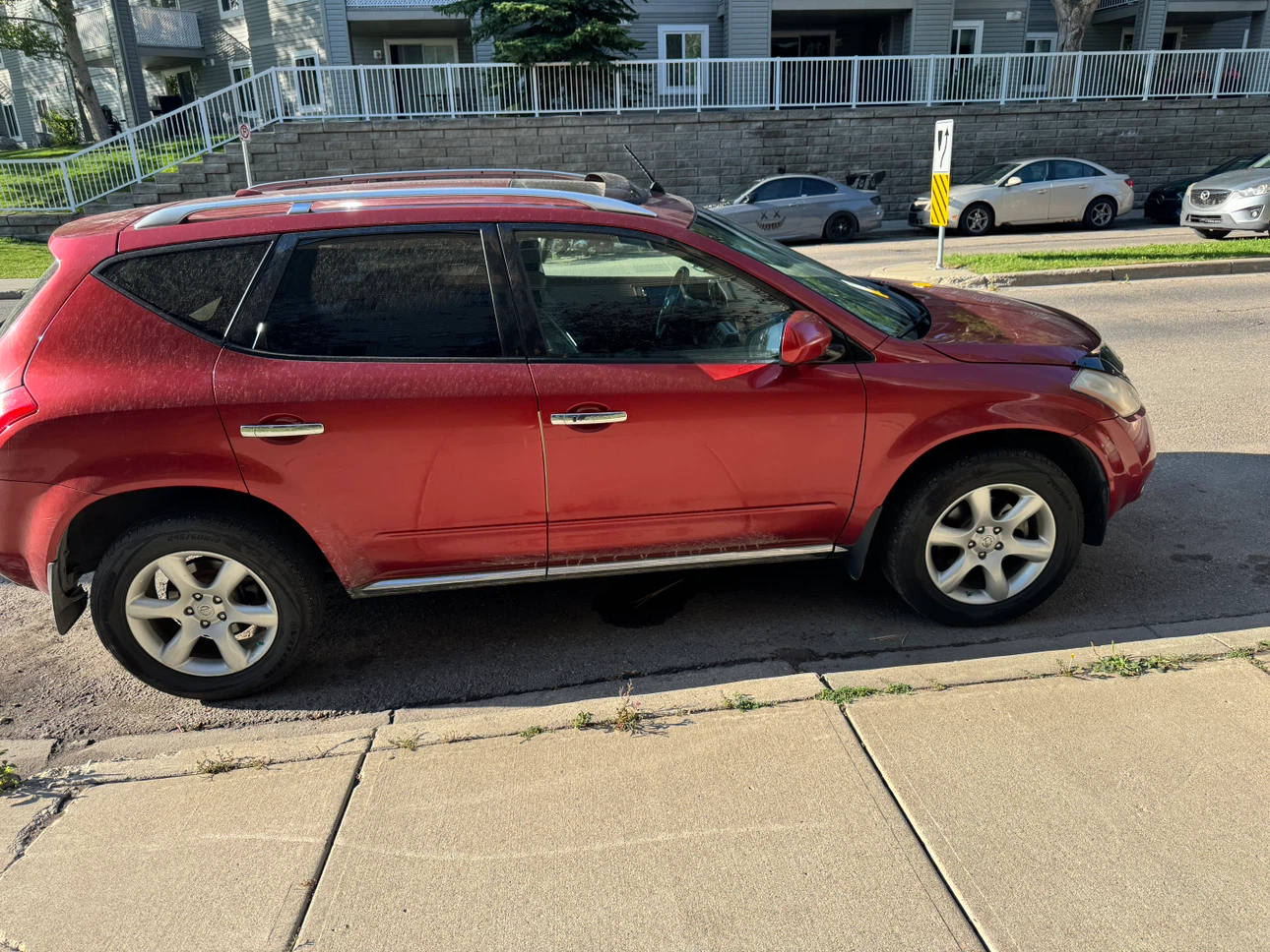 Red Nissan Murano SUV