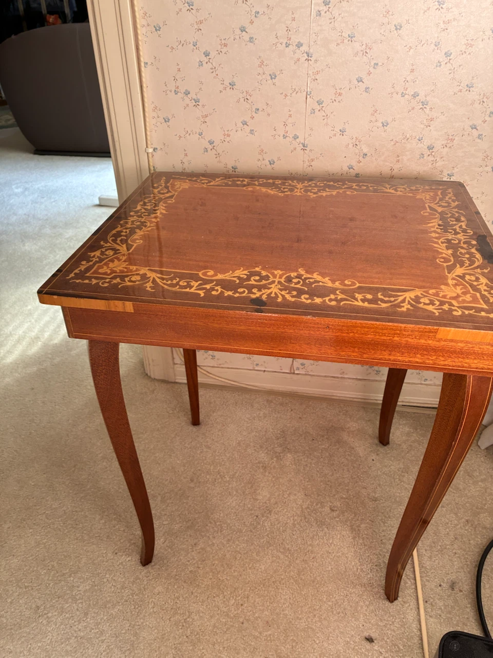 Wooden side table with inlaid design