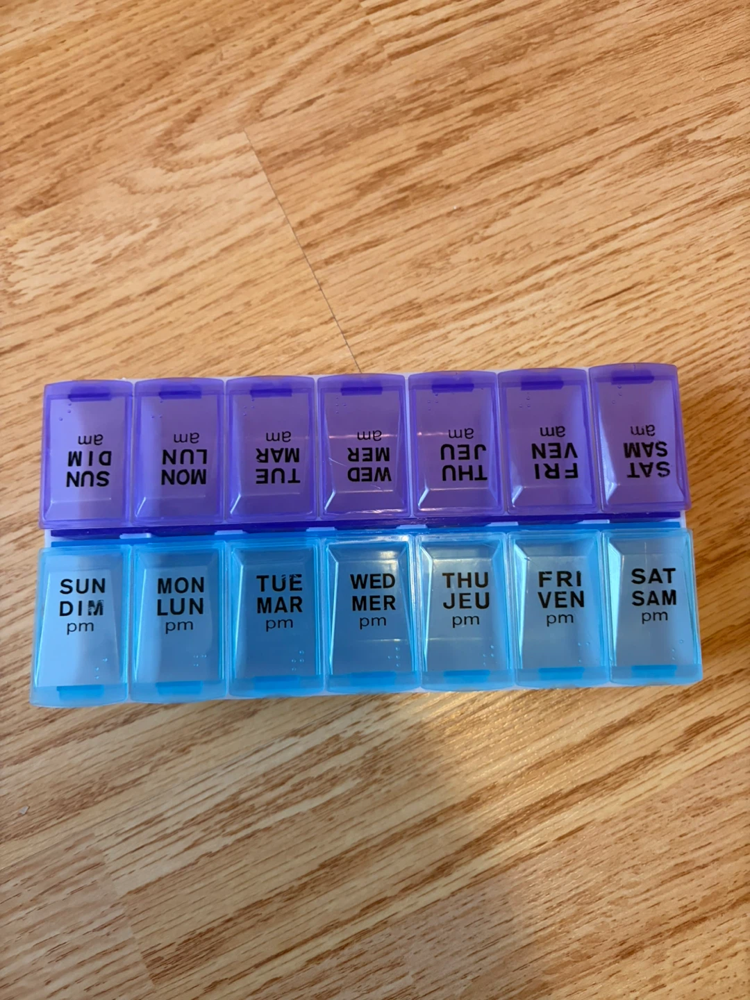 Dual sided 14 day blue and purple AM/PM Pill Organizer