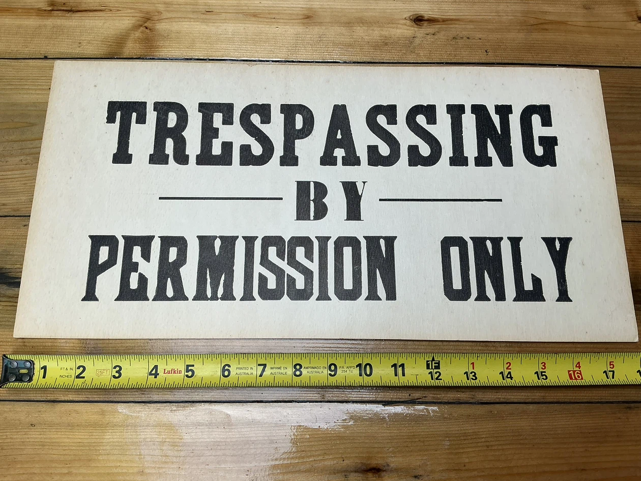 Vintage “Trespassing By Permission Only” Sign