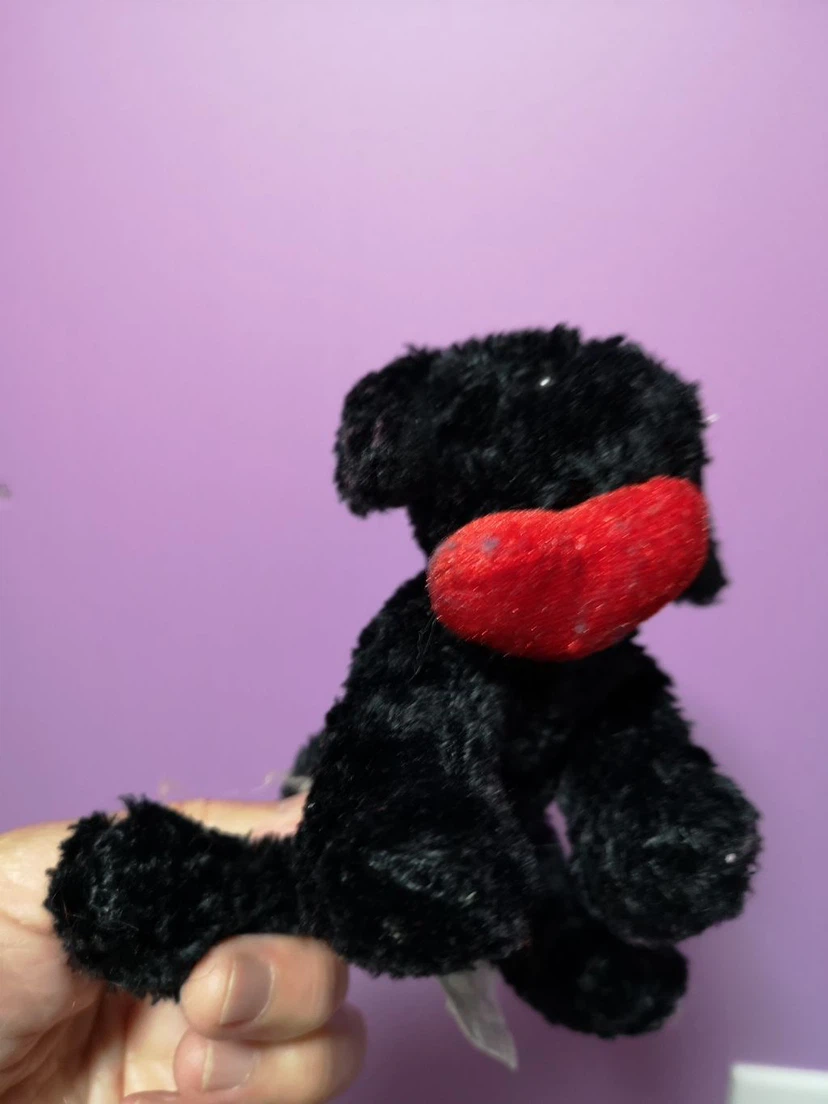 Black stuffed dog with red lips and bow - photo 2