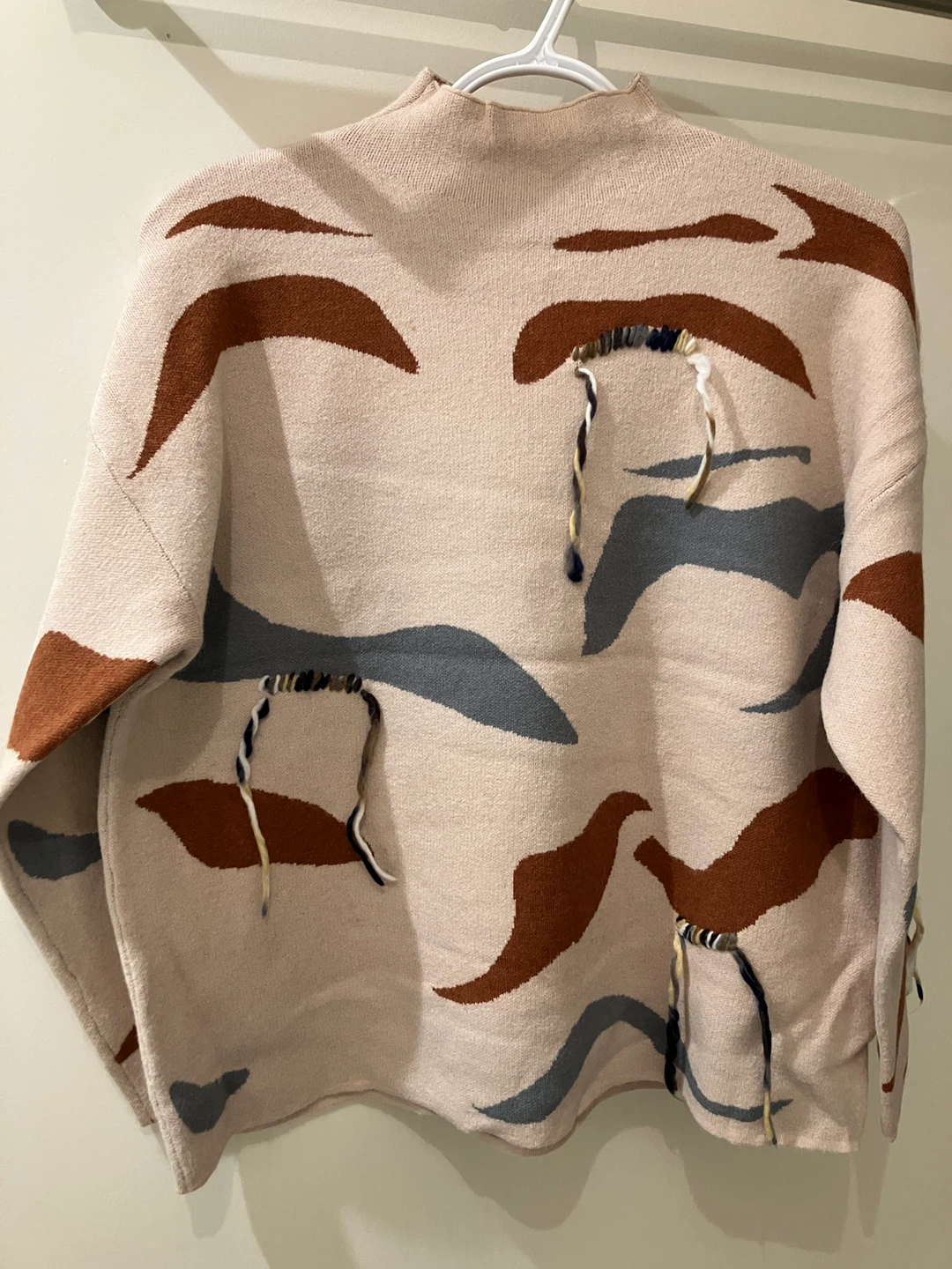 Beige Mock Neck Sweater with Abstract Pattern