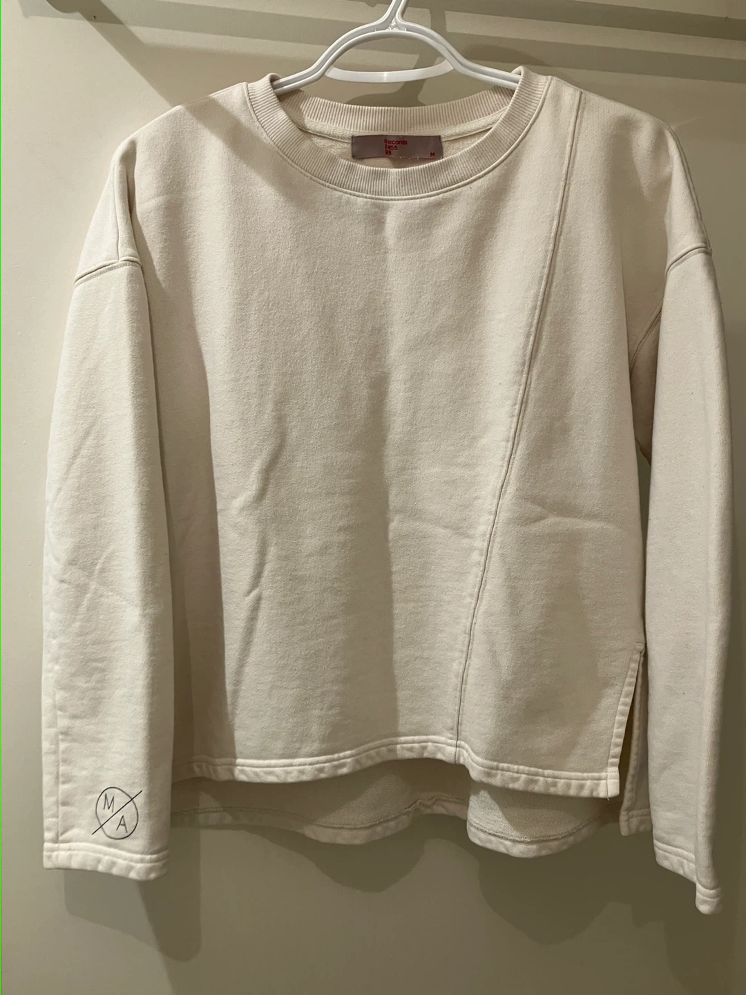 cream coloured sweatshirt