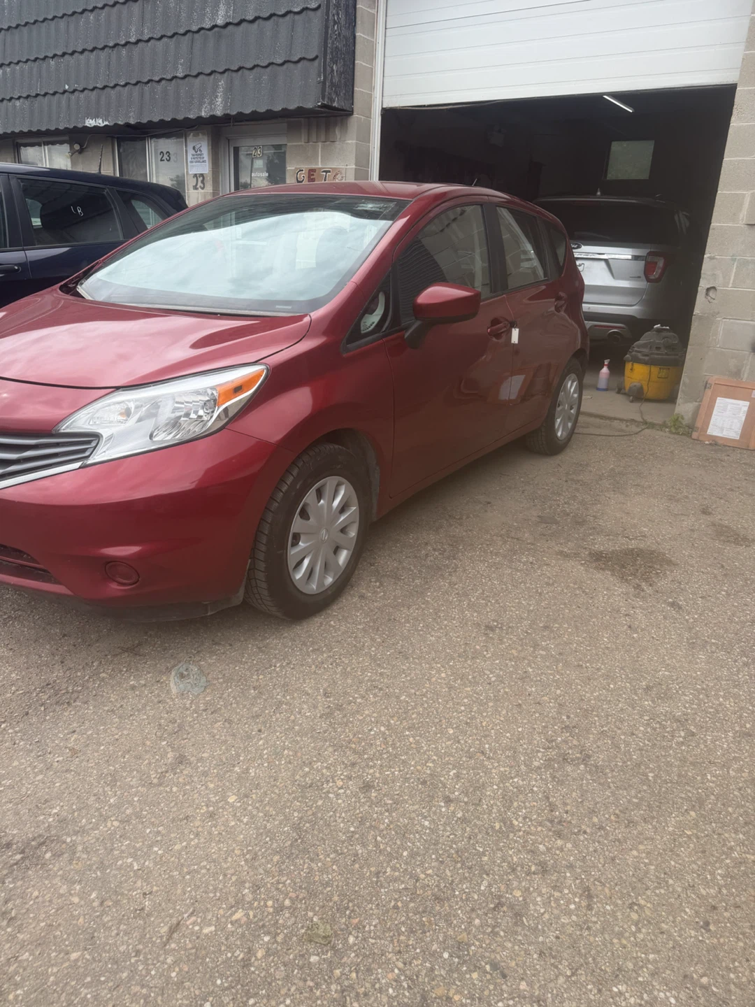 Red Nissan Versa Hatchback