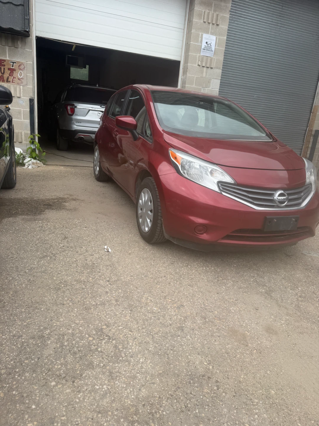 Red Nissan Versa Hatchback - photo 2