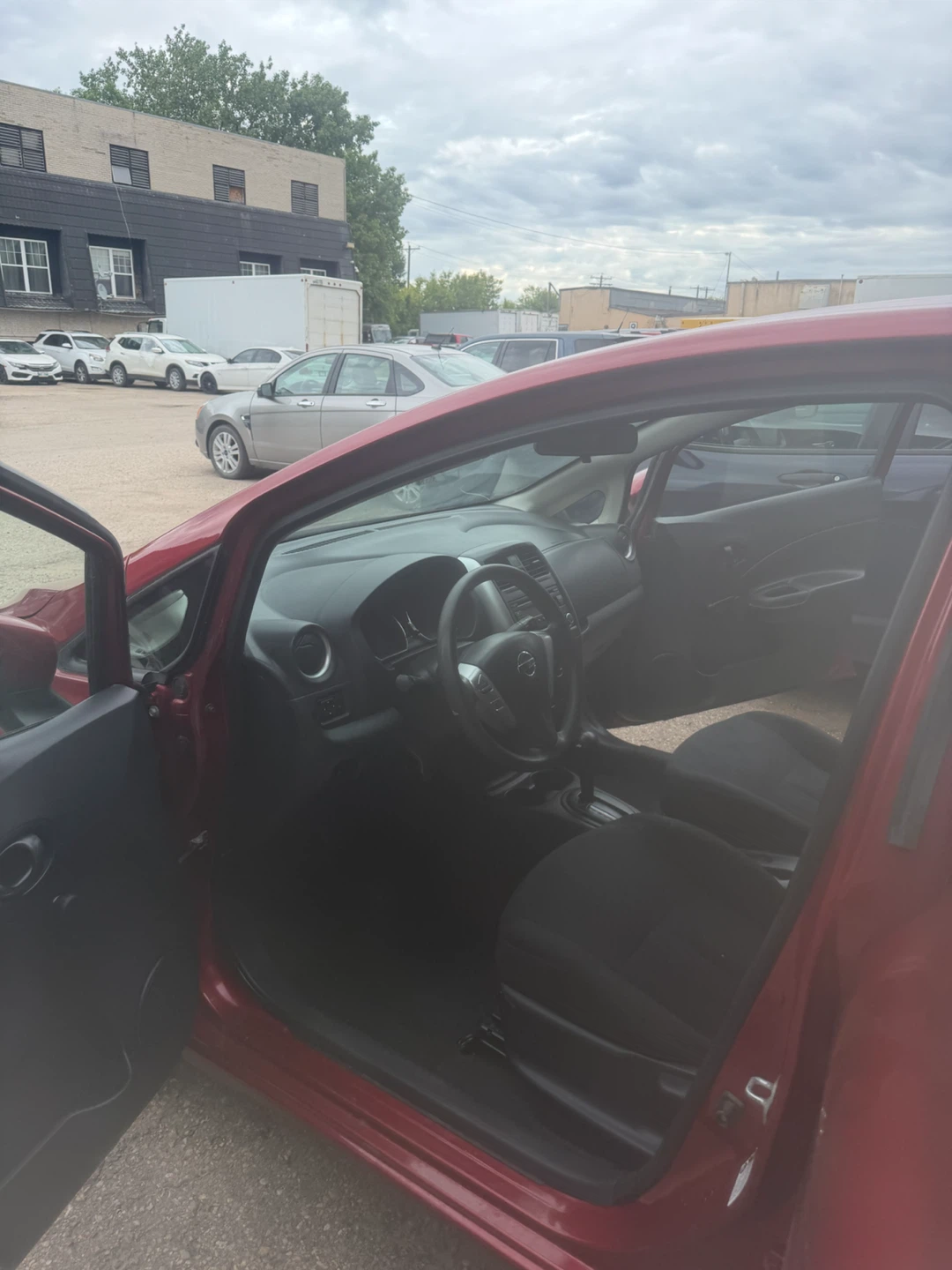 Red Nissan Versa Hatchback - photo 3