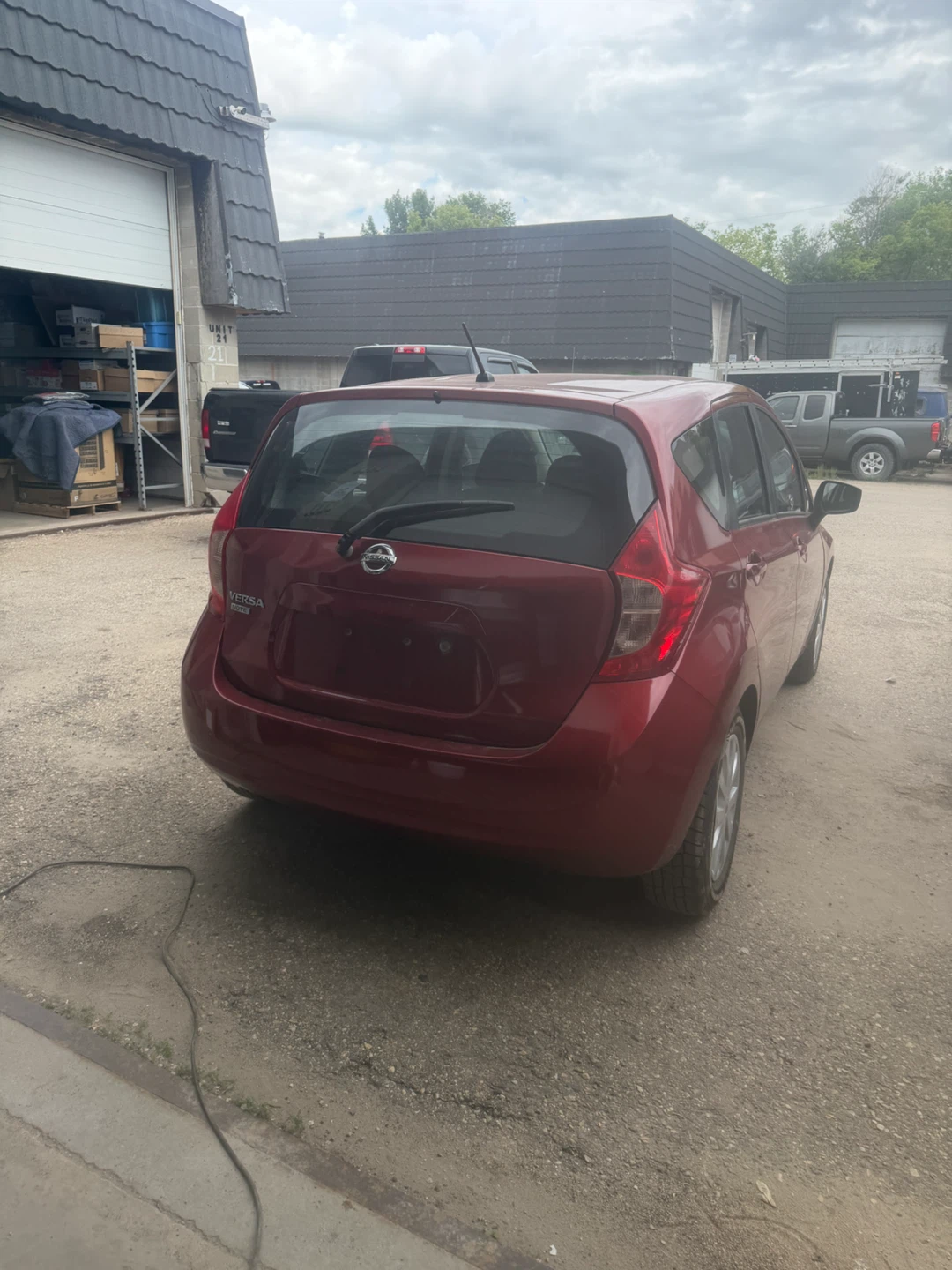Red Nissan Versa Hatchback - photo 5