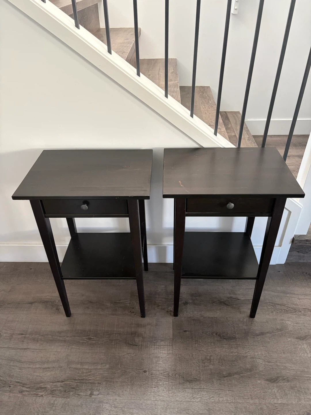 pair of IKEA wooden nightstands in black brown